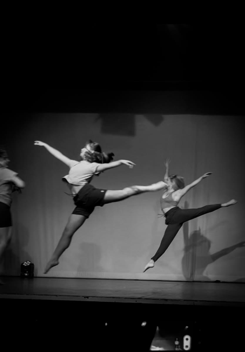 QTC dancers mid-leap