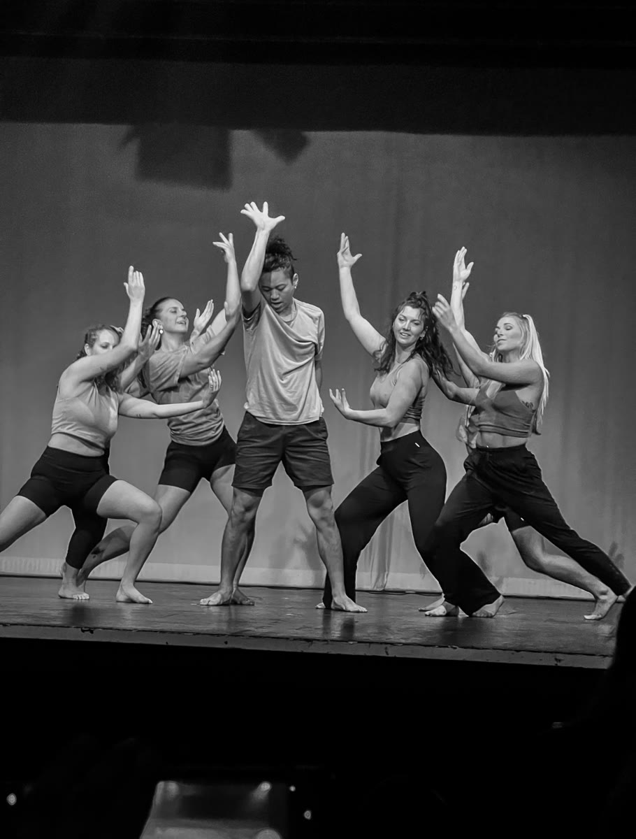 QTC group performance arms raised